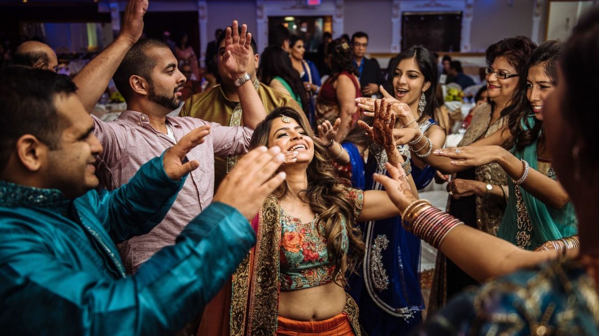 A group of cousins enjoying and dancing in a bachelor party
