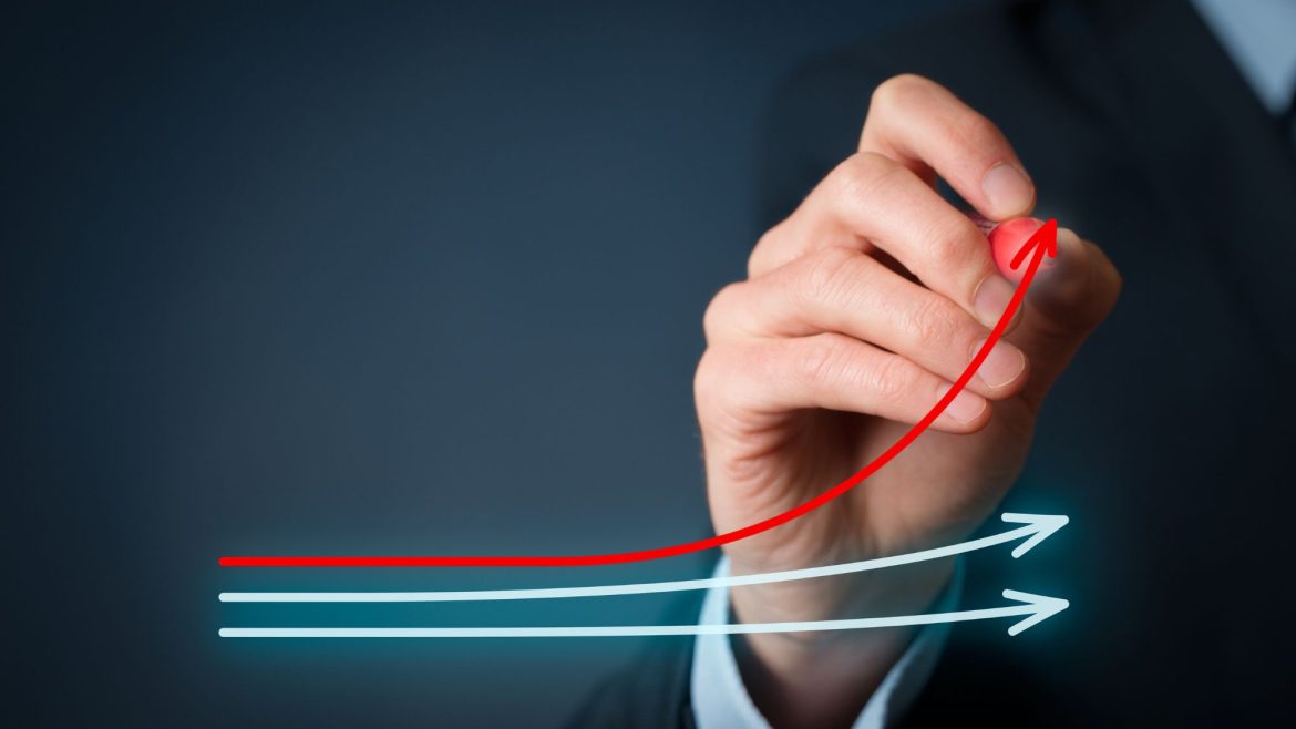 A man drawing graph lines to showing increase online sales and efficiency